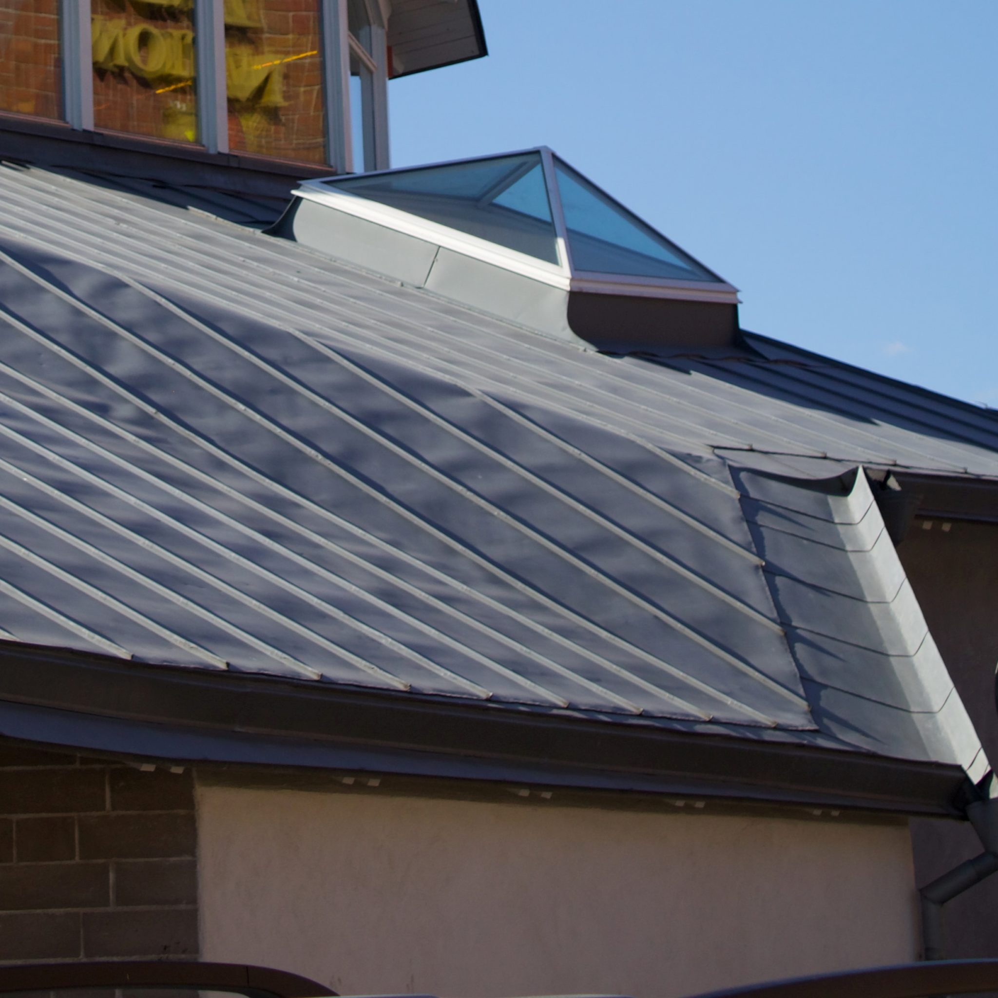 How broad should a metal roof be? | Nombach roofing and Tuckpointing